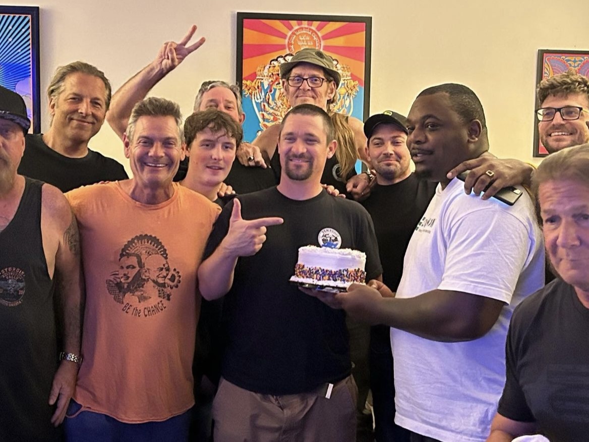 group photo of guys celebrating a birthday